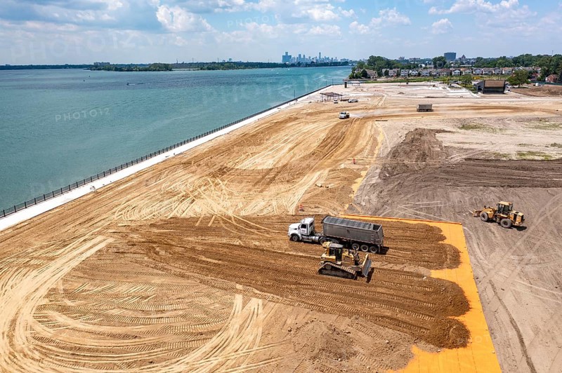 Detroit, Michigan - Workers spread clean dirt after old industrial contamination of cadmium, arsenic, lead, and other metals was removed from A.B. Ford Park on the Detroit River