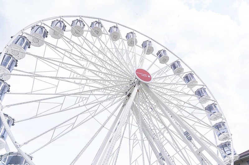 Large Ferris wheel with white gondolas and a sunny sky as a backdrop, Ferris wheel construction, Calw, Germany