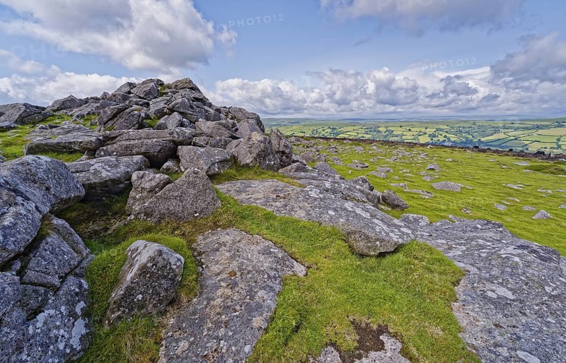 Stones and landscape at the top Tor tor rock hill in Dartmoor National Park. Widecombe-in-the-Moor, Bovey Tracey, Devon, South England, Great Britain