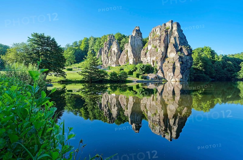 The Externsteine, a sandstone rock formation around 40 metres high in the Teutoburg Forest, are a natural landmark and a protected natural and cultural monument. They are regarded as a place of power and are said to have special cultural and historical significance. The rocks are located by the Wiembecketeich pond. Horn-Meinberg, North Rhine-Westphalia, Germany