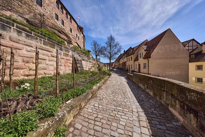 Old town, historic buildings, castle wall, sandstone wall, footpath, cobblestones, trees, garden, blue sky, cirrostratus clouds, Am Ölberg, Nuremberg, Middle Franconia, independent city, Bavaria, Germany