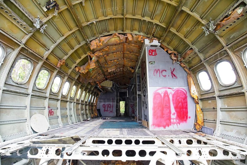 The interior of a derelict, vandalised aircraft in Bangkok, Thailand