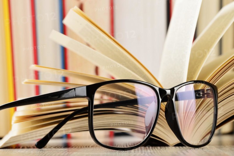 Composition with glasses and books on the table