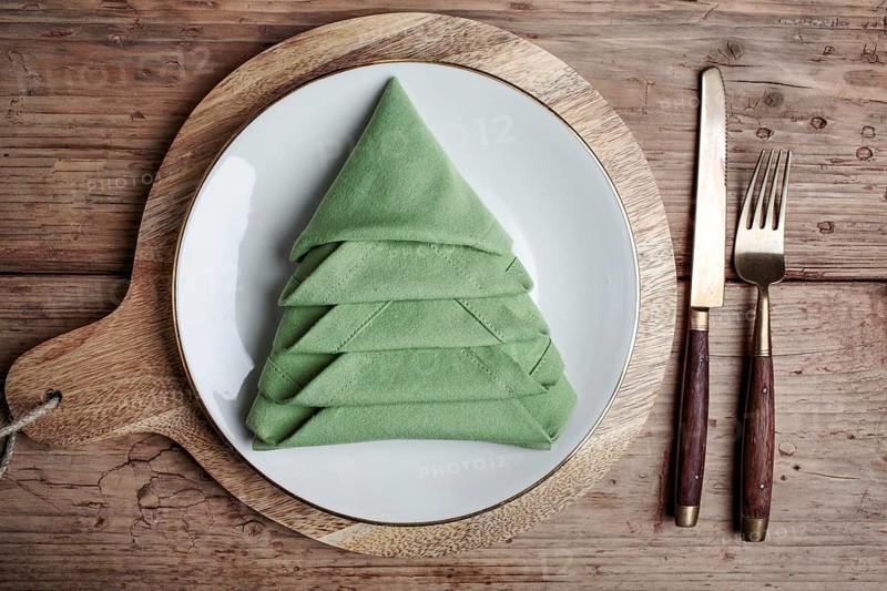 Plates with cutlery and festive decoration
