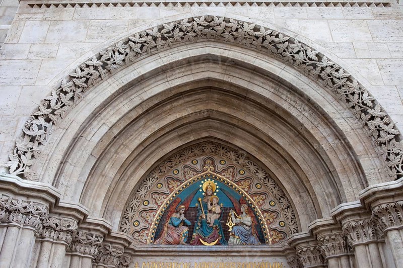 19th century bas-relief of the Madonna with Child between two angels on the Matthias Church tympanum in Budapest, Hungary
