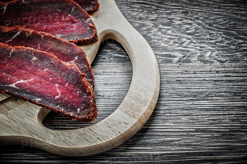 Sliced steak wooden chopping board food concept