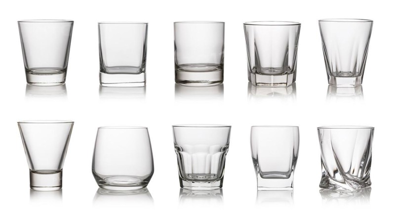 Glass of drinking whiskey isolated on a white background