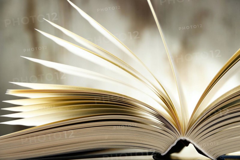 Composition with hardcover book on the table