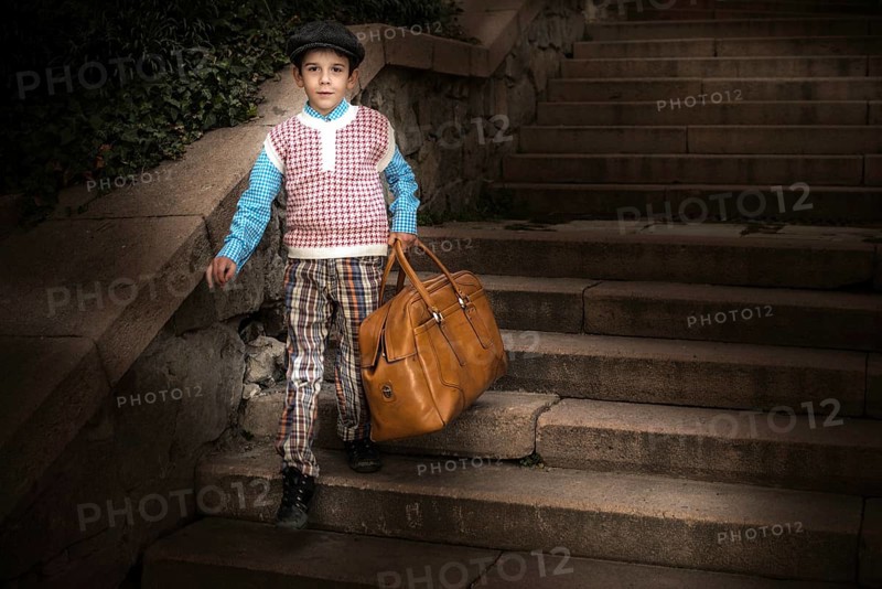 Exterior stairs and child with vintage bag. Vintage clothes style