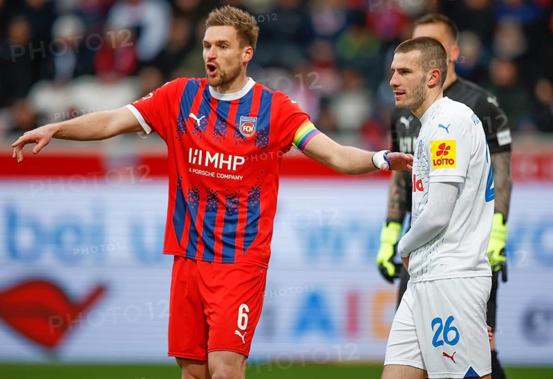 Football, Bundesliga 1, Matchday 26, 2024/2025, 1. FC Heidenheim vs. Holstein Kiel, 16.03.2025, Voith-Arena, Heidenheim, Germany, David ZEC (Holstein Kiel, 26) in a two-legged duel with Patrick MAINKA (1. FC Heidenheim, 06)