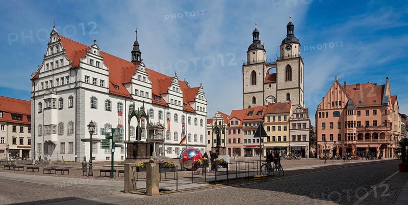 Wittenberg Market Square 79619 Town Hall 16th century by Sebastian Krüger Town Church 14-16th century in front Melanchthon Monument by Johann Heinrich Strack Luther Monument by Gottfried Schadow both 19th century