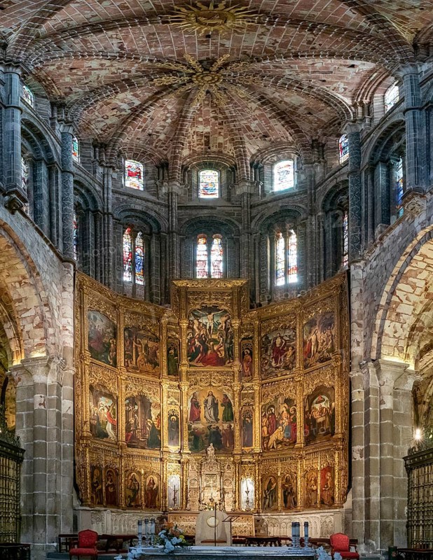 Avila, Spain, 8 April, 2024: view of the central nave and altar with gilded altar piece in the Avila Cathedral