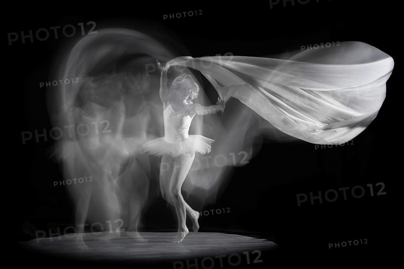 Ballerina in motion with flowing fabric, elegant and graceful in an artistic image, long exposure, studio shot, Mindelheim, Bavaria, Germany
