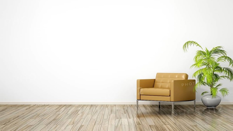 A room with an armchair and space for your content
