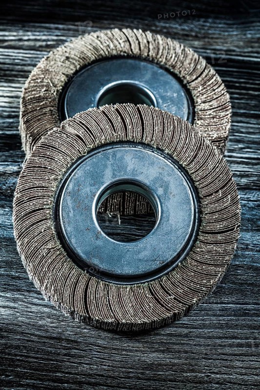 Used grinding wheels on vintage wooden board