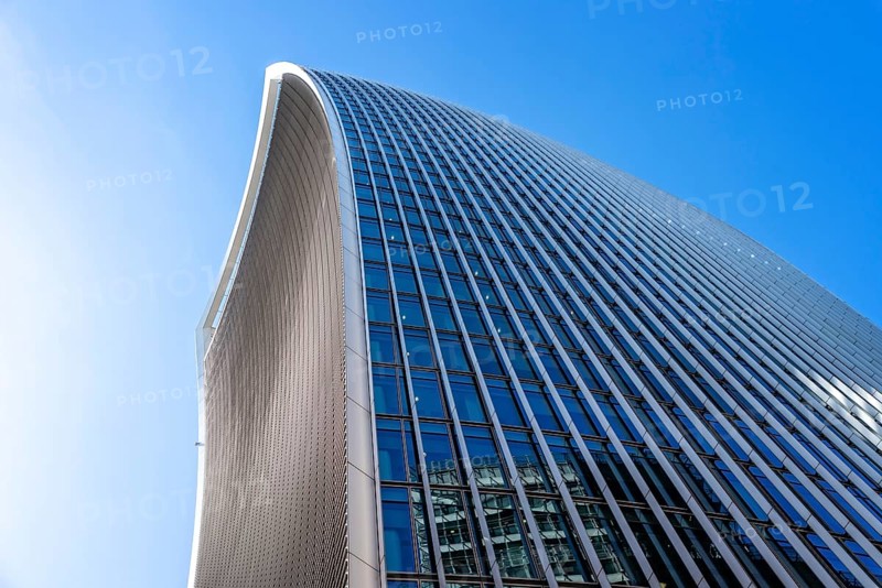 London, UK, May 14, 2019: Low angle view of 20 Fenchurch skyscraper in London agaisnt blue sky. Also known as Walkie Talkie building