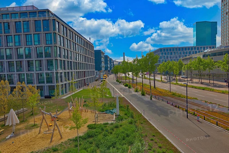 City view with playground and modern buildings under a clear blue sky, street scene, Pfingstweidstrasse, Zurich, Zurich West, Canton of Zurich, Switzerland