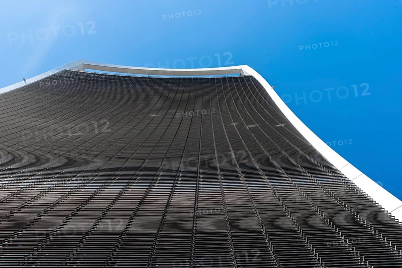 London, UK, May 14, 2019: Low angle view of 20 Fenchurch skyscraper in London agaisnt blue sky. Also known as Walkie Talkie building