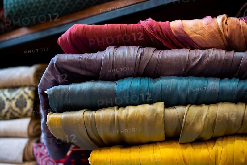 Pile of bright Multi-colored pieces of fabric in a bazaar