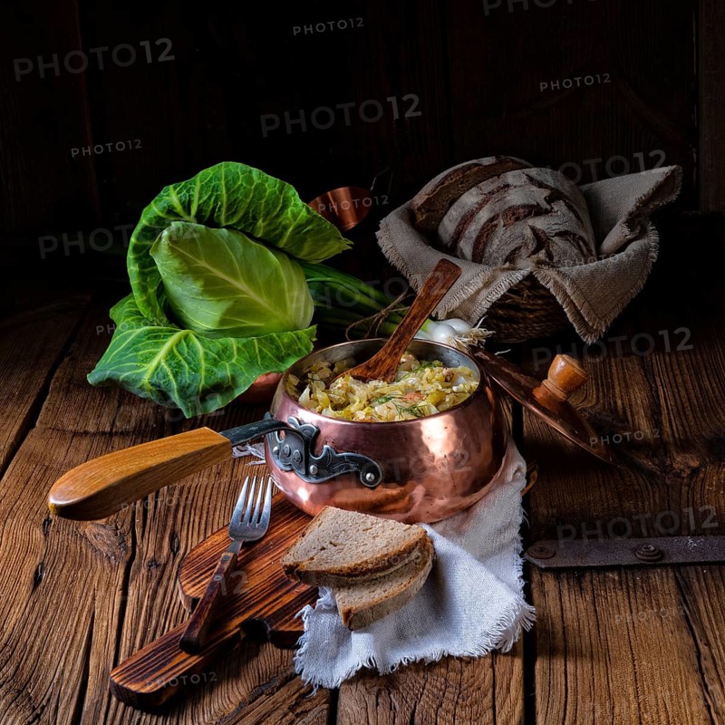 Young and fresh cabbage cooked with bacon cubes