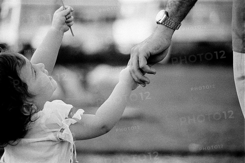 Baby infant girl holding father's hand Model release number 477