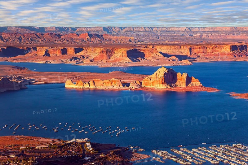 USA. Lake Powell is a reservoir on the Colorado River. The blue water of the lake contrast with the red-brown massifs of the surrounding rocks. The photos were taken from the plane