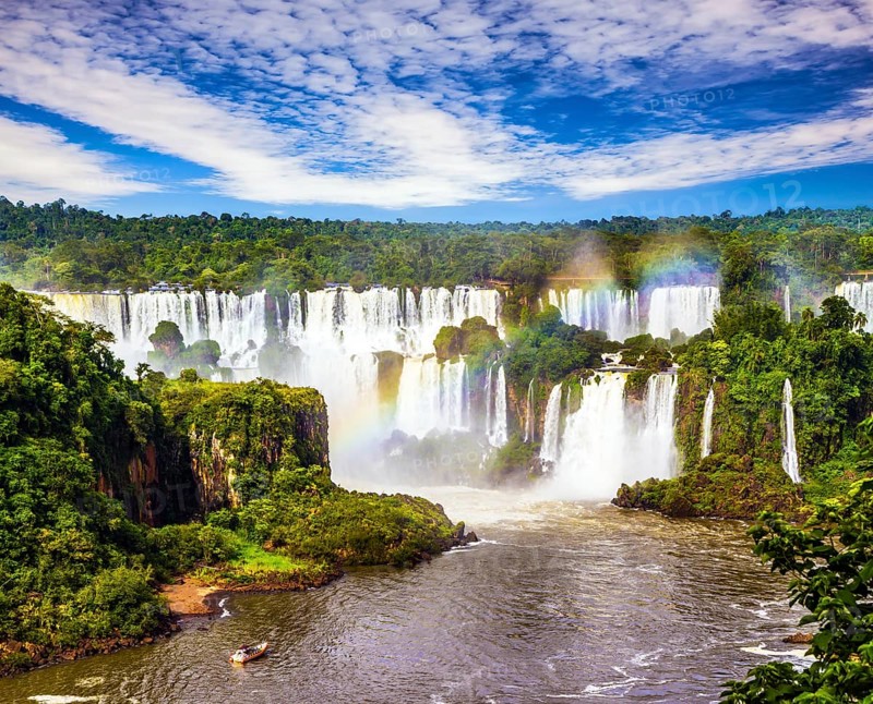 Concept of active and extreme tourism. Incredible exotic waterfalls of Iguazu in South America, on the border of three countries: Brazil, Argentina and Paraguay