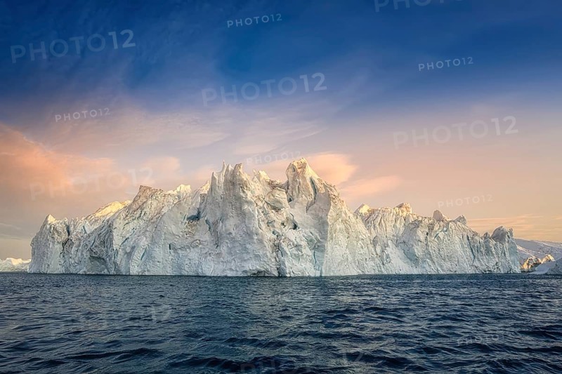Floating glaciers in the rays of the setting sun during a polar night