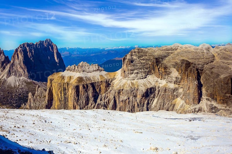 Warm sunny day in the Alps. The Passo-Pordoi pass. Pordoi is a mountain pass of the Dolomites, located between the Sella mountain range and the Marmolada mountain