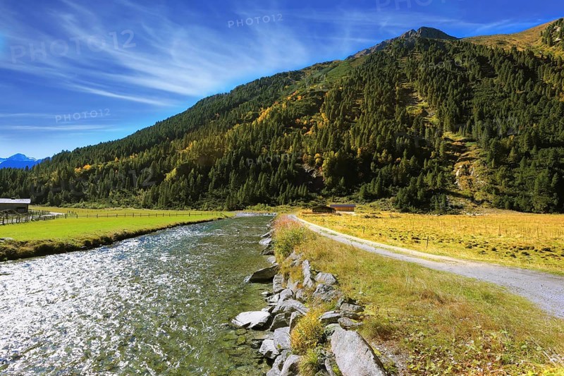 Headwaters of the famous Krimml waterfalls. Crystal clear water glows in the midday sun. Austrian Alps