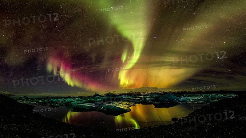 Northern lights aurora in Jokulsarlon glacial river lagoon