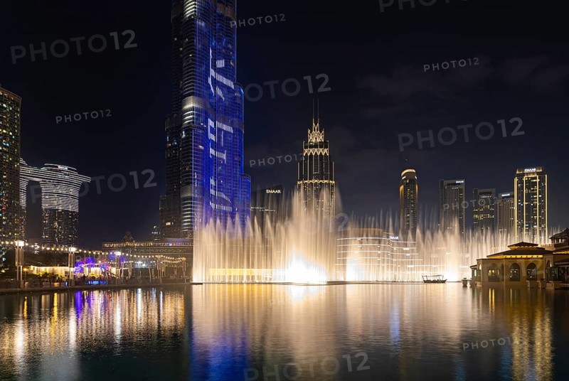 A picture of the Dubai Fountain light and water show at night