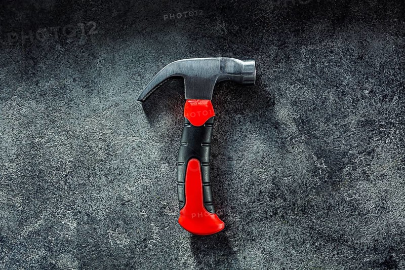 Black Little Claw Hammer On Dark Grey Background