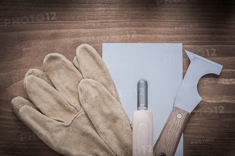 Putty knife plastering trowel and leather working gloves