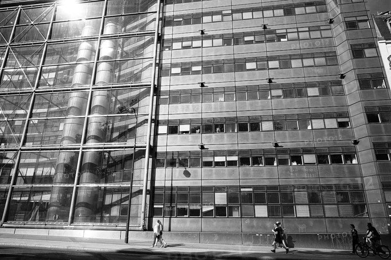 Man and building in paris, france