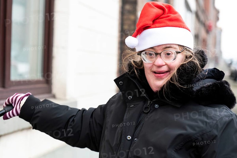 Happy 39 year old woman with Down Syndrome with a christmas cap, Tienen, Hakendover