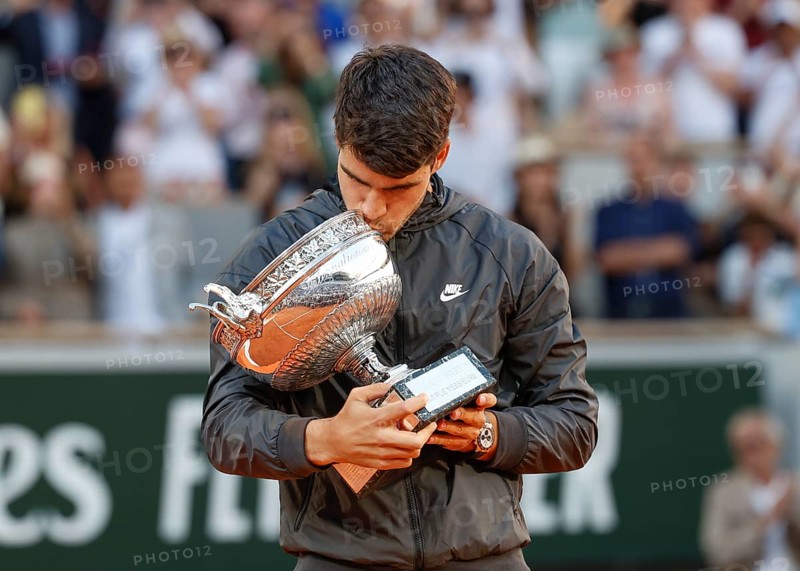 French Open 2024 winner Carlos Alcaraz kissing the trophy at Roland Garros, Paris, France.