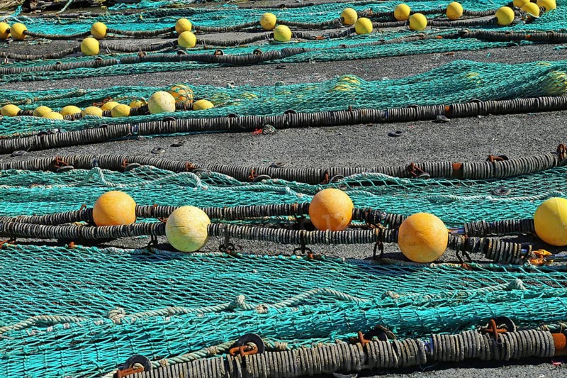 Fishing nets in the port of Loctudy, Finistere, Brittany, France spreading for drying Fishing nets in the port of Loctudy, Brittany, France spreading for drying