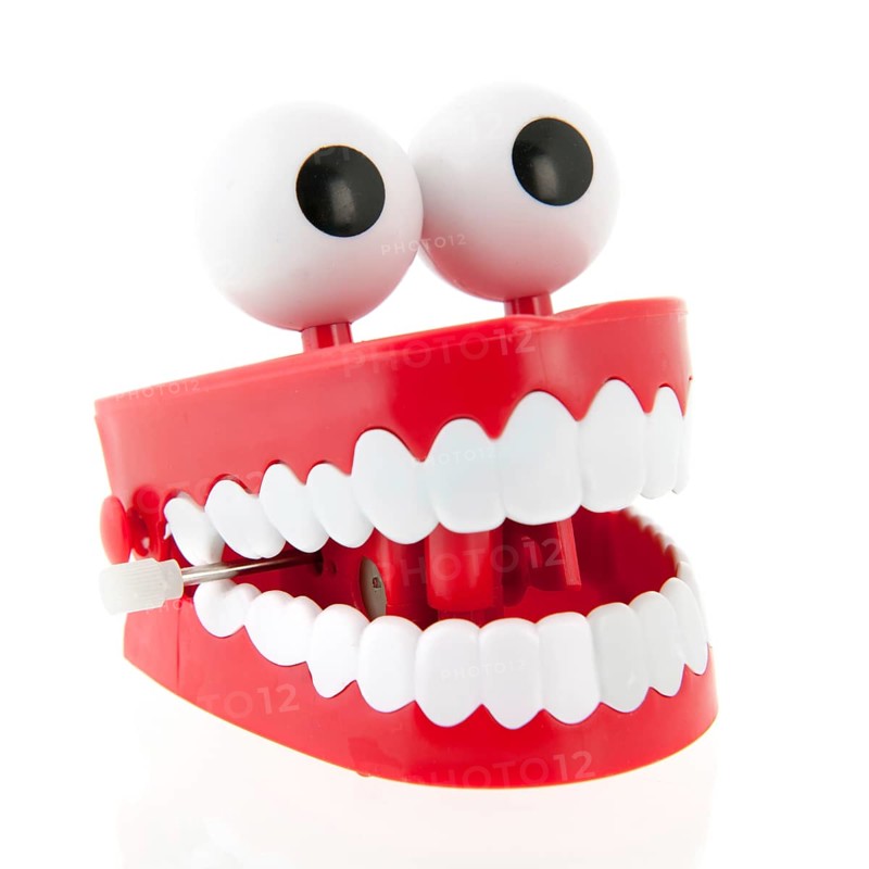 Funny denture with eyes isolated over white background