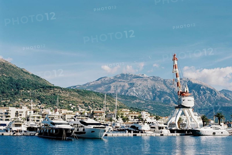 Crane on a platform near the marina in Porto. Montenegro.