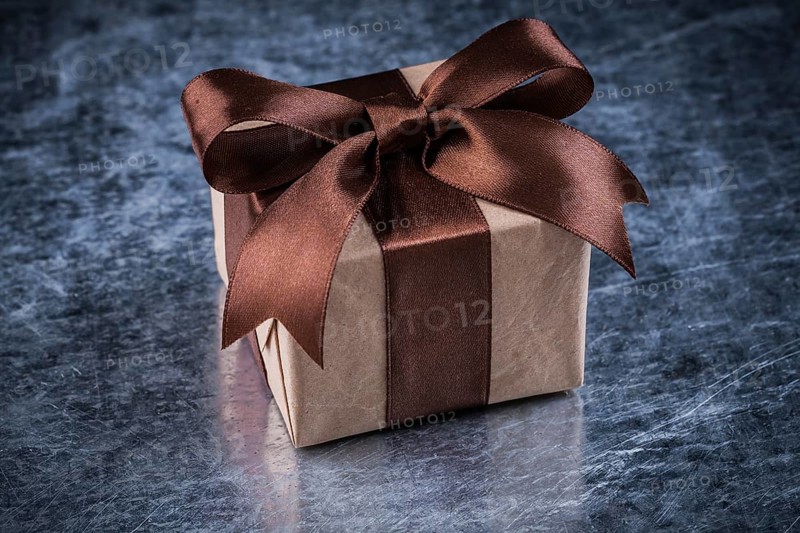 Gift box on scratched metallic background holidays concept