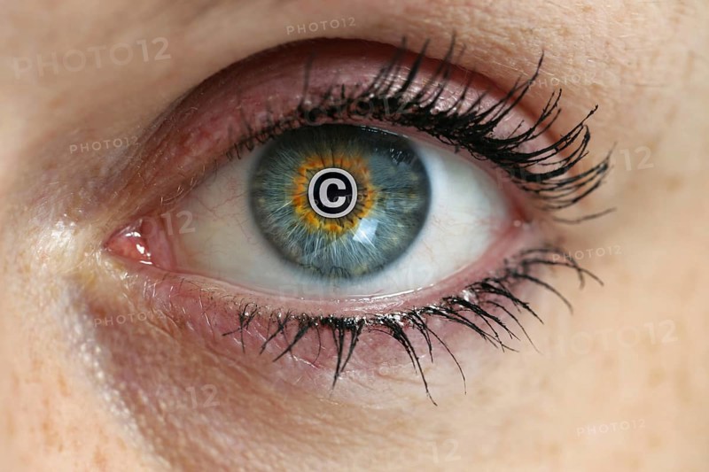 Eye with copyright sign in the pupil concept