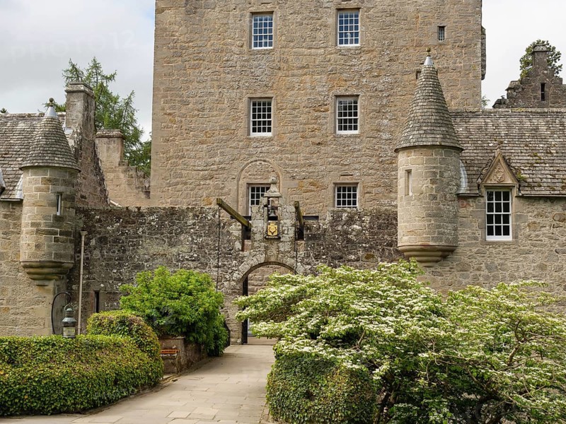 An old castle with stone walls, towers and an entrance surrounded by green plants, inverness, scotland, Great Britain