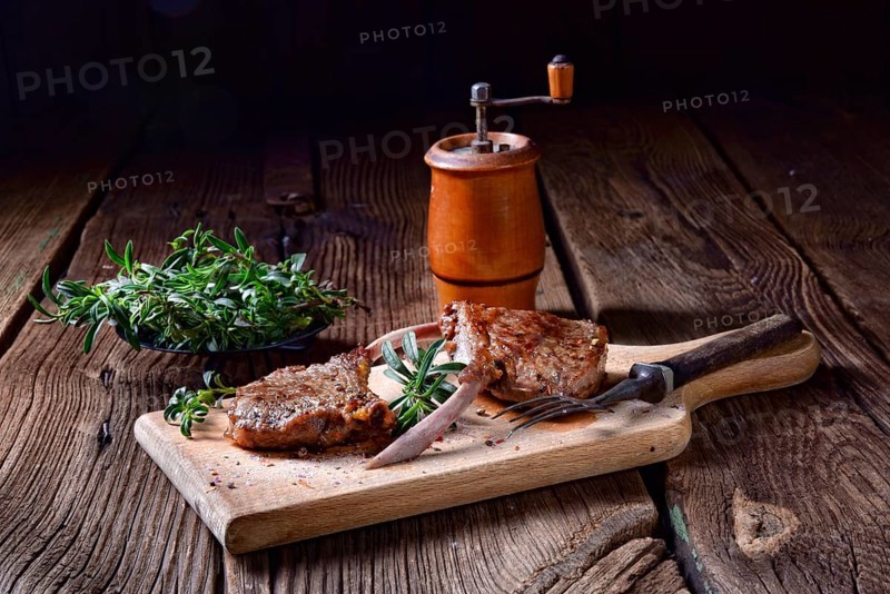 Grilled lamb chops on an old board