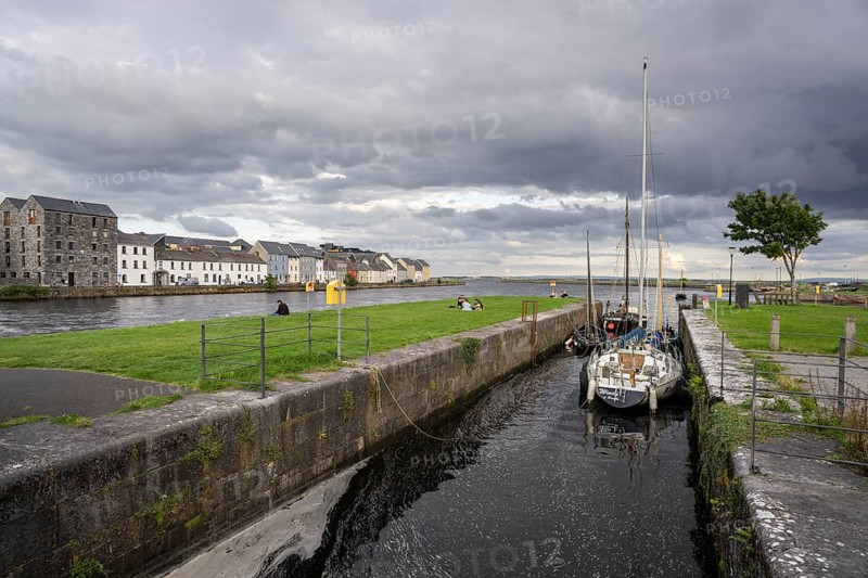 Boat anchored in Eglinton Canal Sea Lock, The Long Walk, Galway, Ireland, United Kingdom
