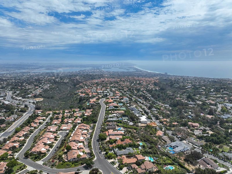 Aerial view over La Jolla Hills with big villas and ocean in the background, San Diego, California, USA