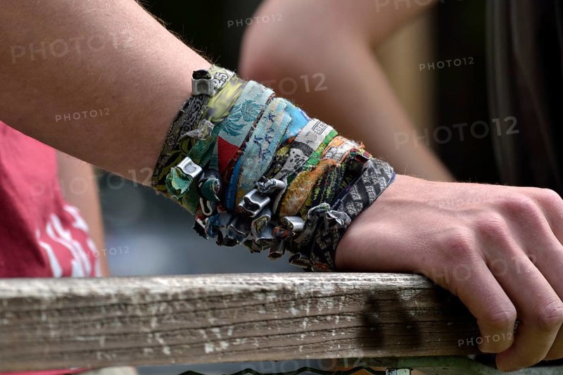 A collection of bracelets on one arm