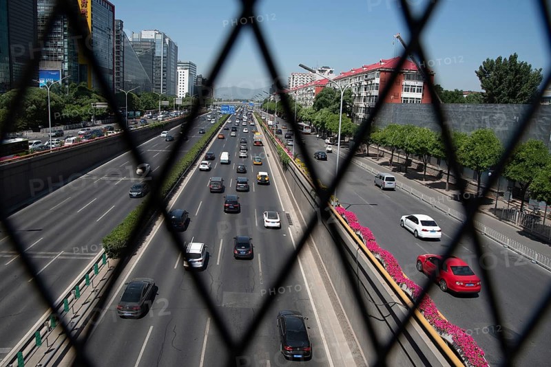 Beijing, China ? June 4 2019: Cars moving fast on a busy multi lane highway in city of Beijing in China