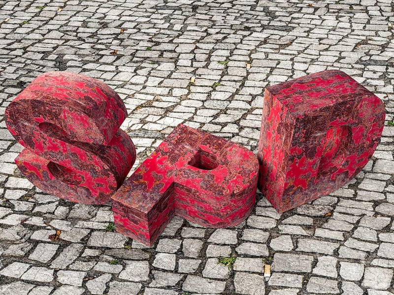 SPD crisis. Rusted party logo on pavement