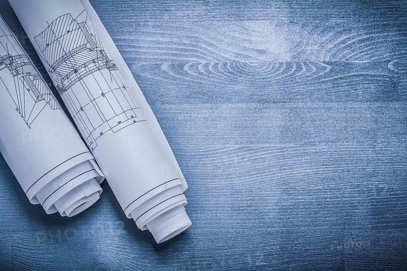 Copyspace image white rolled blueprints
